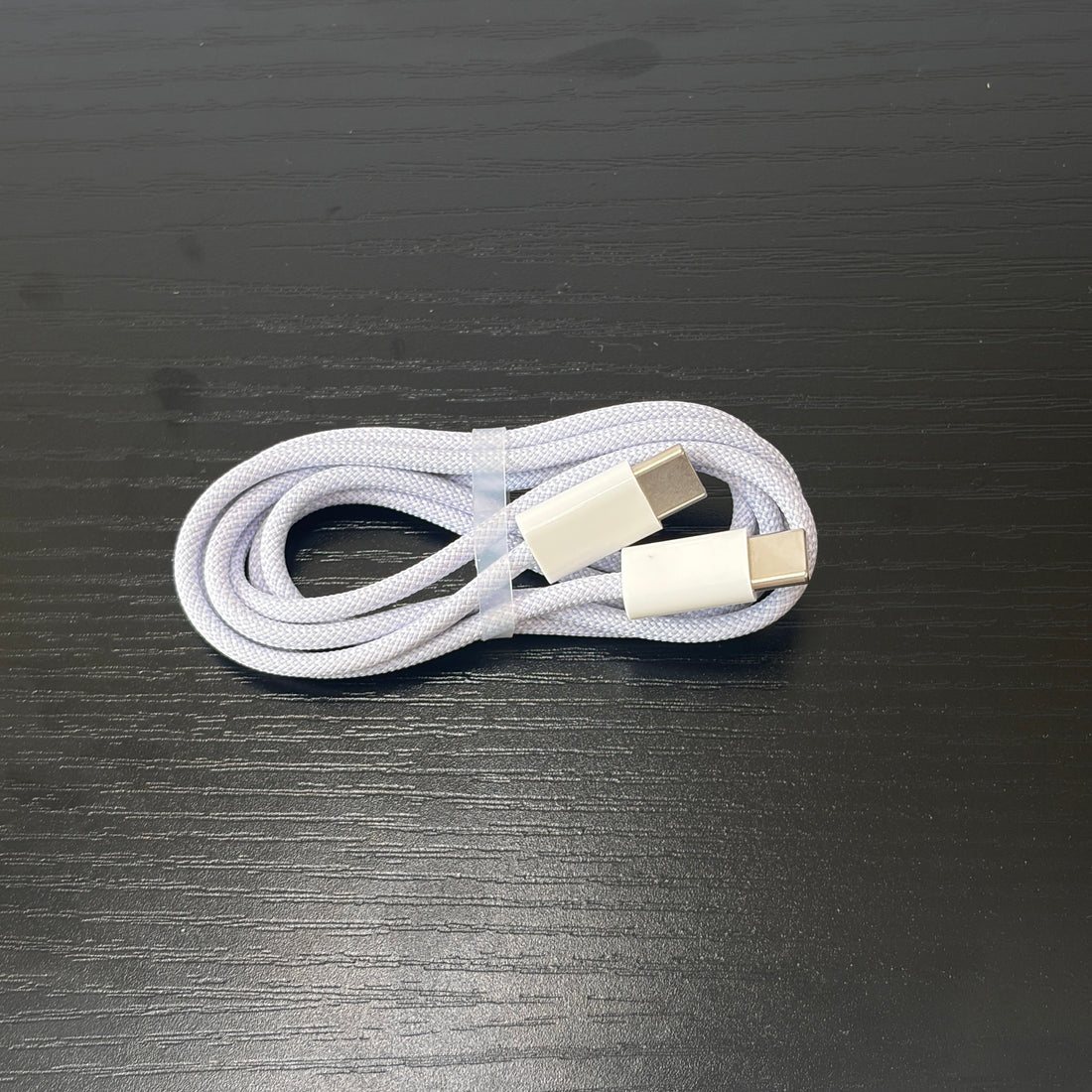 Braided cable coiled neatly on a desk